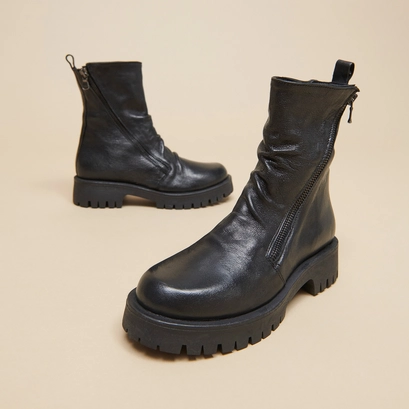 Boots &agrave; fermetures &eacute;clairs et semelles c... en cuir vieilli noir | ROLIN